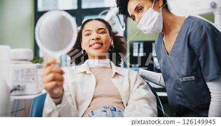 Dentist, woman and happy with results in mirror for teeth whitening, root canal treatment and healthcare service. Dental, professional and patient with oral hygiene, mouth procedure and consultation 126149945