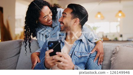 Laugh, couple and phone in home for funny video, social media and bonding together on weekend. Mobile, happy man and woman in living room for joke, streaming comedy or communication online with app Laugh, couple and phone in home for funny video, social media and bonding together on weekend. Mobile, happy man and woman in living room for joke, streaming comedy or communication online with app 126149946