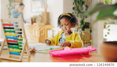 Home, studying and child with notebook, education and learning for elementary with abacus and information. Apartment, student and girl with homework, growth and development of kid with knowledge 126149970