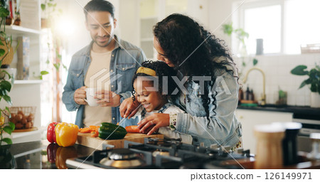 Kitchen, family and learning with vegetables for cooking, nutrition and bonding together in home. Daughter, man and woman with chopping board for meal prep, teaching and support with girl and mother 126149971