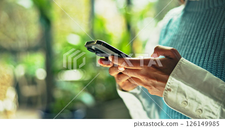 Hands, business and person typing with phone in office for communication, research and sustainable consultant. Space, advisor and mobile app for schedule update, reading information and green project 126149985