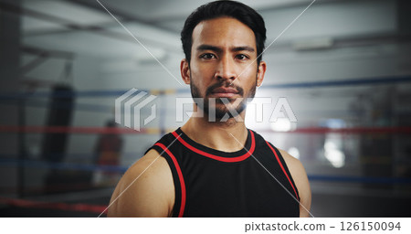 Serious, boxer and portrait of man in gym for mma fighter, workout and training practice. Wresting challenge, martial arts club and sports with person and boxing ring for exercise, fitness and battle 126150094