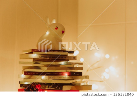 Christmas Tree with Book and Nativity Scene Festive Holiday Decorations and Cozy Seasonal Atmosphere. High quality photo 126151040