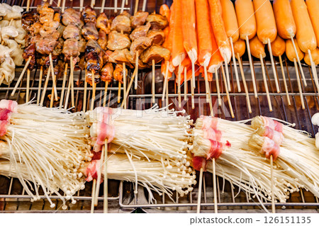sausages seafood and grilled mushrooms on street food market sausages seafood and grilled mushrooms on street food market 126151135