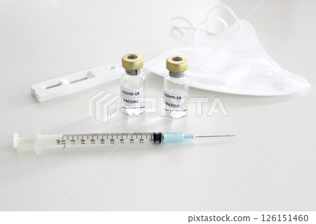 Prevention of Covid-19 concept : Covid-19 vaccine, Covid-19 antigen test kit and mask on the white background Prevention of Covid-19 concept : Covid-19 vaccine, Covid-19 antigen test kit and mask on the white background 126151460