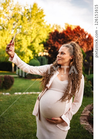 Expecting joy in a sunlit garden moment 126151615