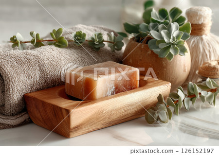 Natural handmade soap in wooden soap dish on marble counter 126152197