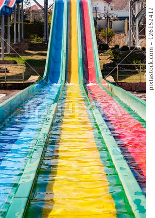 colorful slides gutters in aquapark colorful slides gutters in aquapark 126152412
