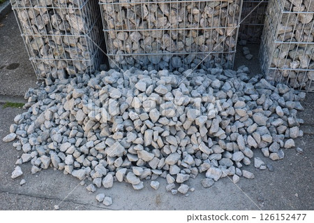 A pile of rocks is sitting on the ground A pile of rocks is sitting on the ground 126152477