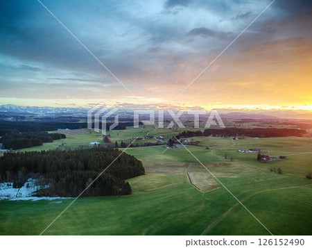 Beautiful, serene landscape with a bright orange and pink sky 126152490