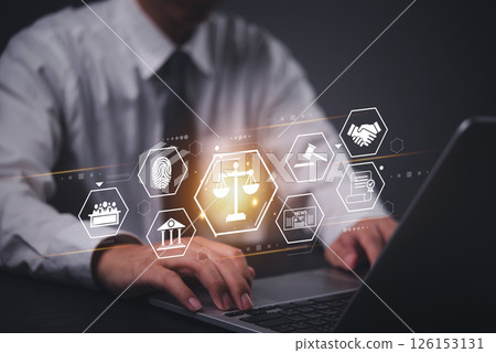 Businessman using a laptop with a digital law and justice interface, representing online legal services. regulations with AI legal services and technology. 126153131
