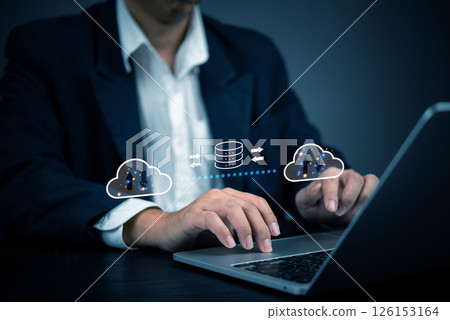 Businessman using cloud computing technology for data transfer and storage. Concept of cloud computing, data security, online storage, network infrastructure, and digital transformation in business. Businessman using cloud computing technology for data transfer and storage. Concept of cloud computing, data security, online storage, network infrastructure, and digital transformation in business. 126153164
