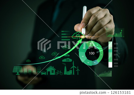 Businessman analyzing carbon footprint reduction with a futuristic dashboard. Concept of sustainability, renewable energy, CO2 emissions management, and environmental responsibility in business. Businessman analyzing carbon footprint reduction with a futuristic dashboard. Concept of sustainability, renewable energy, CO2 emissions management, and environmental responsibility in business. 126153181