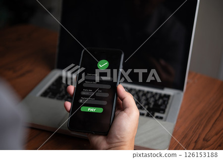 Online payment confirmation on mobile. Digital transaction, e-commerce, fintech, and contactless payment concept. Secure mobile banking and financial technology for fast and safe purchases. Online payment confirmation on mobile. Digital transaction, e-commerce, fintech, and contactless payment concept. Secure mobile banking and financial technology for fast and safe purchases. 126153188