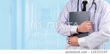 Doctor holding a clipboard check up report, standing in a hospital hallway. Medical healthcare services, clinical expertise, patient care, hospital environment, and healthcare industry. Doctor holding a clipboard check up report, standing in a hospital hallway. Medical healthcare services, clinical expertise, patient care, hospital environment, and healthcare industry. 126153197