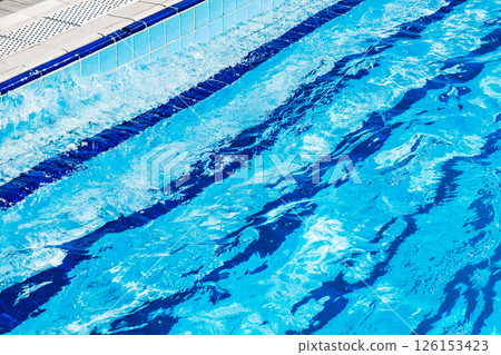 waves on blue water in pool and steps on bottom waves on blue water in pool and steps on bottom 126153423