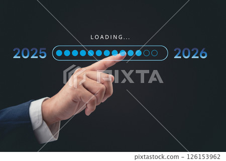 A professional hand interacting with a digital loading bar, marking the transition from 2025 to 2026. The concept represents progress, time, and future planning in business and technology. A professional hand interacting with a digital loading bar, marking the transition from 2025 to 2026. The concept represents progress, time, and future planning in business and technology. 126153962