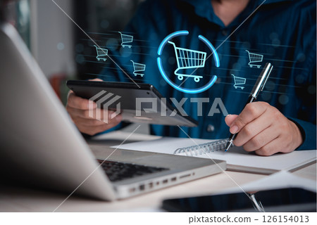 business professional analyzing shopping cart data , representing e-commerce operations, online sales, and consumer purchasing behavior. 126154013