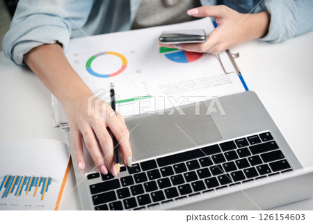 Corporate financial management and business strategy planning with laptop, charts, and digital data. 126154603