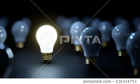 Unique light bulb shines brightest among many others in a dark setting to symbolize innovation and ideas Unique light bulb shines brightest among many others in a dark setting to symbolize innovation and ideas 126154753