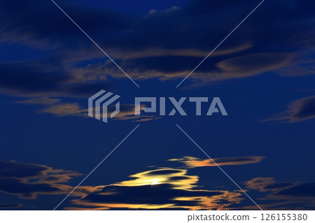 Corn moon peeking out from the clouds Corn moon peeking out from the clouds 126155380