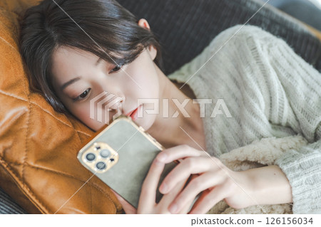 Japanese woman sleeping on the sofa 126156034