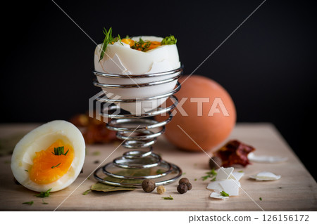 morning soft boiled egg in egg cup isolated on black background morning soft boiled egg in egg cup isolated on black background 126156172
