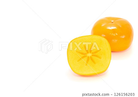 Okesa persimmon from Niigata Prefecture, cut, cross section, seedless, light background 126156203