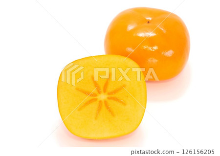 Okesa persimmon from Niigata Prefecture, cut, cross section, seedless, light background 126156205