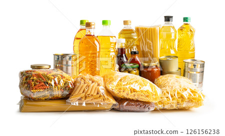 Foodstuff for donation, storage and delivery. Various food, pasta, cooking oil and canned food in cardboard box. 126156238