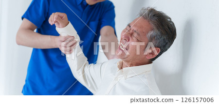 Elderly man with shoulder pain and staff 126157006