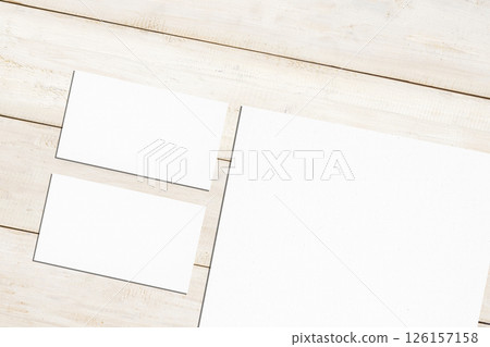 Top view set of business letterhead and business card on a wooden background. Blank paper or sheet. Mockup or copy space for your design 126157158