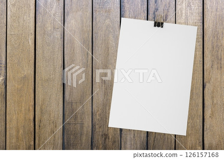Top view of business letterhead and blank binder clip on wooden background. Blank paper or sheet. Mockup or copy space for your design Top view of business letterhead and blank binder clip on wooden background. Blank paper or sheet. Mockup or copy space for your design 126157168