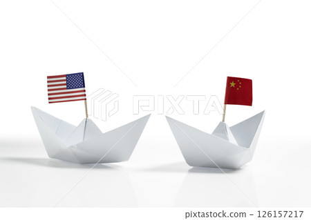 Paper boat with the USA or United States of America and China flags on a white background. Concept of the United States of America versus China trade war disputes or economic conflict 126157217