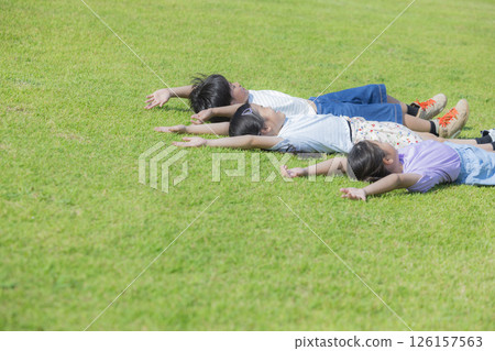 Kids playing on the grassy plaza 126157563