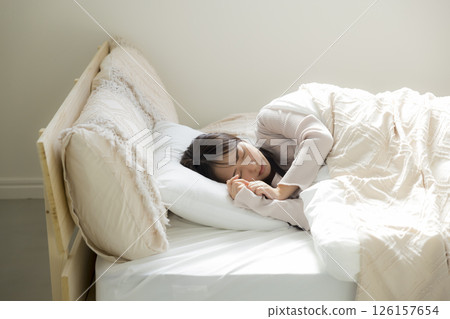 Sleepy woman in bed 126157654