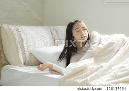 Sleepy woman in bed Sleepy woman in bed 126157664