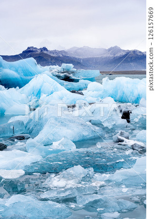 View of the melting glacier on Jokulsarlon or Glacier Lagoon, Iceland View of the melting glacier on Jokulsarlon or Glacier Lagoon, Iceland 126157669