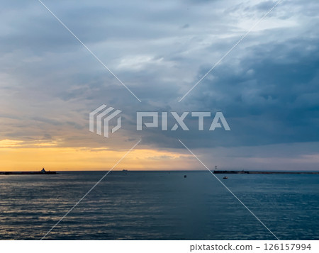 scenery beach and sea waves with sunset on the horizon 126157994