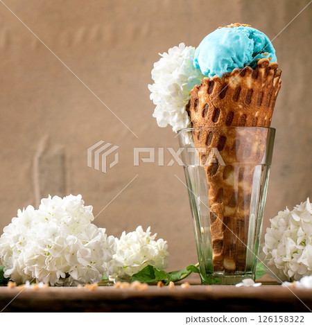 Turquoise ice cream in waffle cone 126158322
