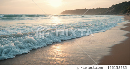 Crashing Ocean Waves at Sunrise A wide-angle shot capturing the moment frothy turquoise waves collide with the sandy shore under 126158583