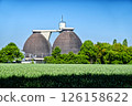 Biogas plant generating renewable energy in green field 126158622