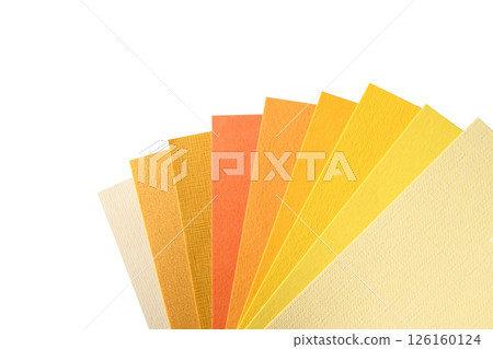 A palette of shades of yellow paper on a white background. Samples of paper for typography. Goods for creativity. A palette of shades of yellow paper on a white background. Samples of paper for typography. Goods for creativity. 126160124
