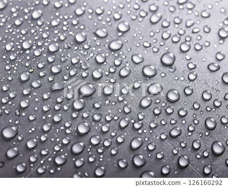 Image of water droplets and a water-repellent car hood, silver 126160292