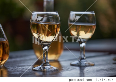 Drinking wine on a summer evening Drinking wine on a summer evening 126160307