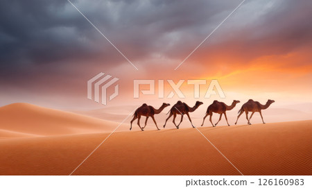 Camels walking across vast desert landscape under dramatic sunset sky with clouds Camels walking across vast desert landscape under dramatic sunset sky with clouds 126160983