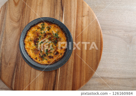 baked ravioli in cheese. Delicious freshly prepared meal, perfect for menus, restaurants, or food delivery concepts. baked ravioli in cheese. Delicious freshly prepared meal, perfect for menus, restaurants, or food delivery concepts. 126160984