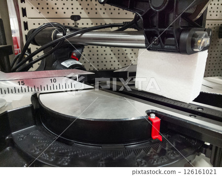 Precision cutting tool in action showcases intricate craftsmanship at workshop 126161021