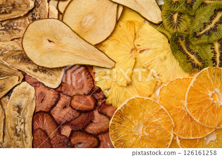 Mix of dried various fruits. Diet food. Natural and healthy snacks. Diet chips made from dried fruits. 126161258