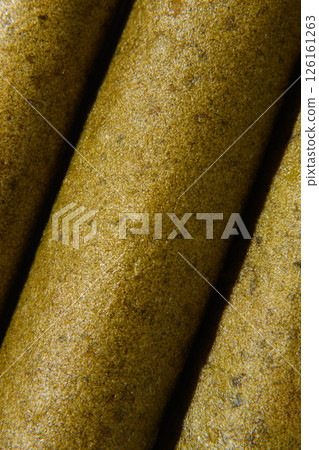 Pastila, with spinach texture, macro. Advertising vertical photo. Pastila, with spinach texture, macro. Advertising vertical photo. 126161263